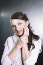 Closeup. serious young woman in white sweater.isolated on black