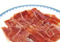 Closeup of serrano ham slices on a dish. Jabugo Royalty Free Stock Photo