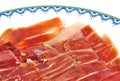 Closeup of serrano ham slices on a white dish Royalty Free Stock Photo