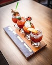 Closeup of set margarita cocktails with slice of lime and salty rim on wooden tray on bar counter Royalty Free Stock Photo