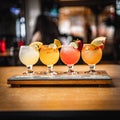 Closeup of set margarita cocktails with slice of lime and salty rim on wooden tray on bar counter Royalty Free Stock Photo