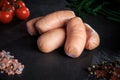 closeup set of thick short sausages with dill and tomatoes Royalty Free Stock Photo