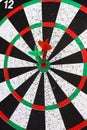 Closeup. several Arrows dart hitting the center of the target d