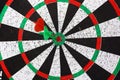 Closeup. several Arrows dart hitting the center of the target d