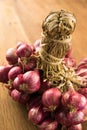 Closeup shallots group on wood background Royalty Free Stock Photo