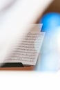 Closeup of sheet music in white bright background with colorful flares and selective focus Royalty Free Stock Photo