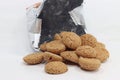 Closeup shhot of an opened bag of amaretti biscuits isolated on white background Royalty Free Stock Photo