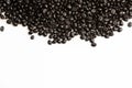 Closeup of shiny black coffee beans on a white background Royalty Free Stock Photo