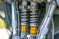 closeup of shock absorbers and struts on aircraft gear