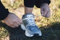 Closeup, shoes ad man runner in a park for training, sports or morning cardio preparation. Hand, sneaker and athletic Royalty Free Stock Photo