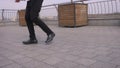 Closeup shoot of male legs doing an amazing footwork and dancing on the street outdoors in the city