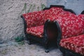 Closeup shot of abandoned antique armchairs in an outdoor environment