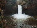 Closeup shot of Abiqua falls with a shallow basin in the forest of Oregon