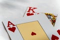 Closeup shot of the Ace and King of hearts on top of each other