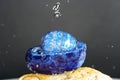 Closeup shot of an agate precious stone with variety of blue quartz with gray background