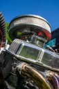 Closeup shot of an air filter of a retro car under a blue sky - technology Royalty Free Stock Photo