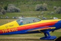 Closeup shot of an airplane with a female pilot and a man inside at Hangariada aeronautical festival