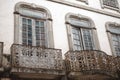 Closeup shot of an ancient building wooden windows and beautiful balcony grid