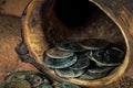 Closeup shot of ancient Roman coins coming out of a cornucopia. Royalty Free Stock Photo