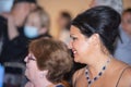 Closeup shot of Anna Netrebko in the hallway with fans after her concert in Madrid, Spain