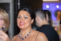 Closeup shot of Anna Netrebko in the hallway with fans after her concert in Madrid, Spain