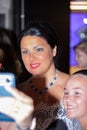 Closeup shot of Anna Netrebko in the hallway with fans after her concert in Madrid, Spain