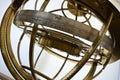 Closeup shot of an antique brass armillary sphere with zodiac signs