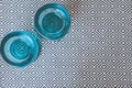 Closeup shot of aqua candle holders on a black and white patterned table cloth in the kitchen Royalty Free Stock Photo