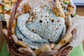 Closeup shot of armenian tasty bread with nettle called Zhingalov hats in the basket Royalty Free Stock Photo