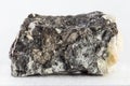 Closeup shot of an arsenopyrite mineral isolated on a white background