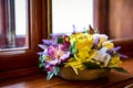 Closeup shot of an artificial bouquet on a windowsill Royalty Free Stock Photo