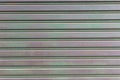 A closeup shot of automatic metal roller door used in factory, storage, garage, and industrial warehouse. Royalty Free Stock Photo