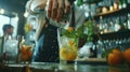 A closeup shot of a bartender skillfully muddling ingredients for a mocktail Royalty Free Stock Photo
