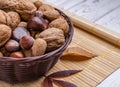 Closeup shot of a basket full of chestnuts, walnuts, hazelnuts, almonds Royalty Free Stock Photo