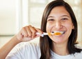 No one ever regrets brushing their teeth. Closeup shot of a beautiful young woman brushing her teeth. Royalty Free Stock Photo