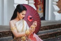 Closeup shot of Beautyful Thai woman wearing thai traditional clothing. She is wearing a bracelet