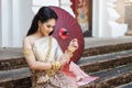 Closeup shot of Beautyful Thai woman wearing thai traditional clothing. She is wearing a bracelet