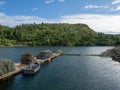 Closeup shot of berth for boats with equipment on the background of mountains covered with greenery Royalty Free Stock Photo