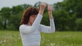 Closeup shot of bhastrika pranayama practice. Sportswoman waves hands up and down sitting caremat. Fast breathing yoga