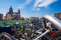 Closeup shot of bicycles on the background of the Basilica of Saint Nicholas Amsterdam Royalty Free Stock Photo
