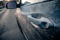 Closeup shot of a black frozen car