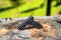 Closeup shot of the black handgun on the wood Royalty Free Stock Photo