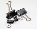 Closeup shot of black multi-sized foldback clips isolated on white Royalty Free Stock Photo