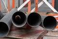 Closeup shot of black welded pipes on the construction site