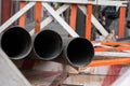 Closeup shot of black welded pipes on the construction site