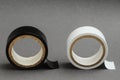 Closeup shot of black and white insulating tapes on a gray background Royalty Free Stock Photo