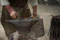 Closeup shot of a blacksmith working with hot iron