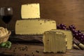 Closeup shot of blocks of gourmet Beaufort cheese and a glass of wine