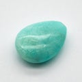 Closeup shot of a blue amazonite crystal on a white surface