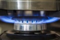 Closeup shot of blue fire from domestic kitchen stove. Gas cooke Royalty Free Stock Photo